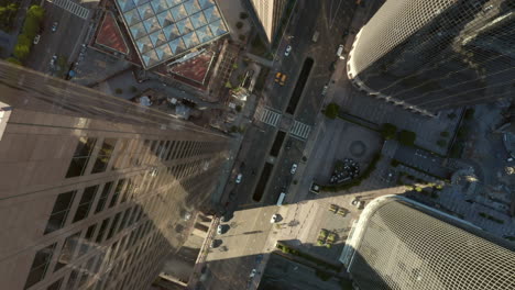 Little-Car-traffic-on-Main-Road-of-Big-City-Downtown-Los-Angeles,-due-to-Covid-19-Coronavirus-Pandemic-Lockdown-restrictions,-Aerial-Birds-Eye-Overhead-View