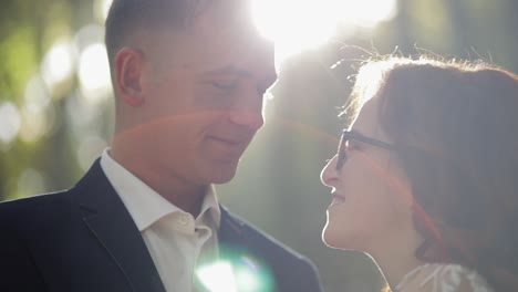 groom with bride in the forest park. wedding couple. happy family