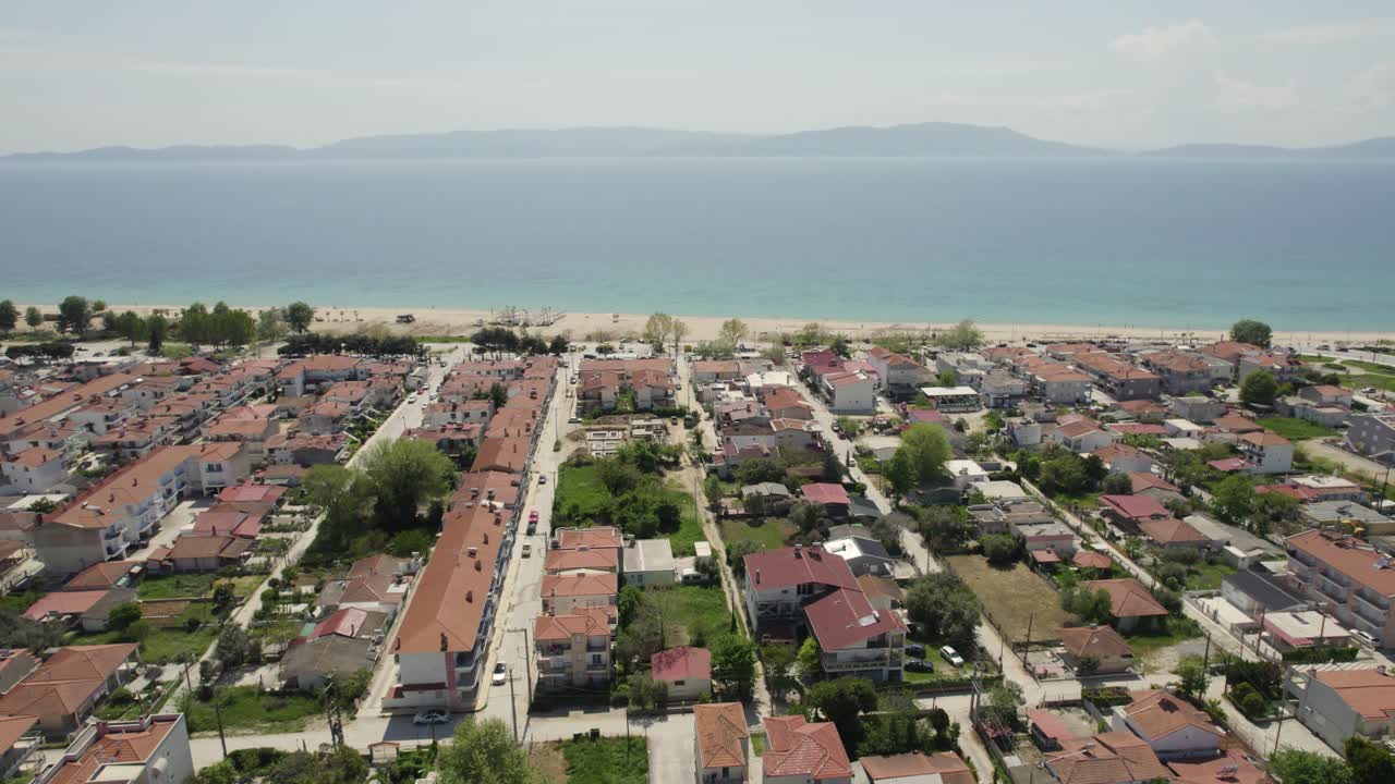 Ofrynio Beach, Tuzla Seaside Village in Greece, Aerial Point of Interest Shot of City Center Residential Developed Land
