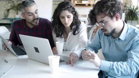 focused coworkers working over new project