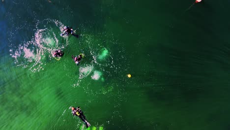 Divers-Swim-In-Calm-Green-Water-Of-Sea-Near-Lysekil-In-Sweden