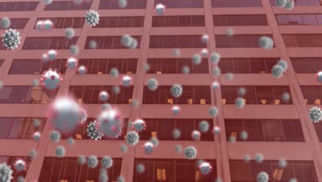 animation of covid 19 cells floating over office building on red background