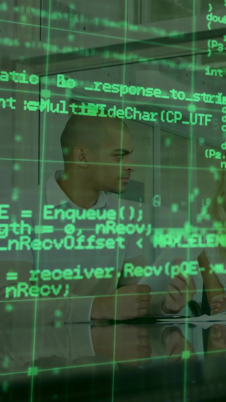 Vertical video: Shifting green code exposing man white-shirt turning, discussing tablet at desk