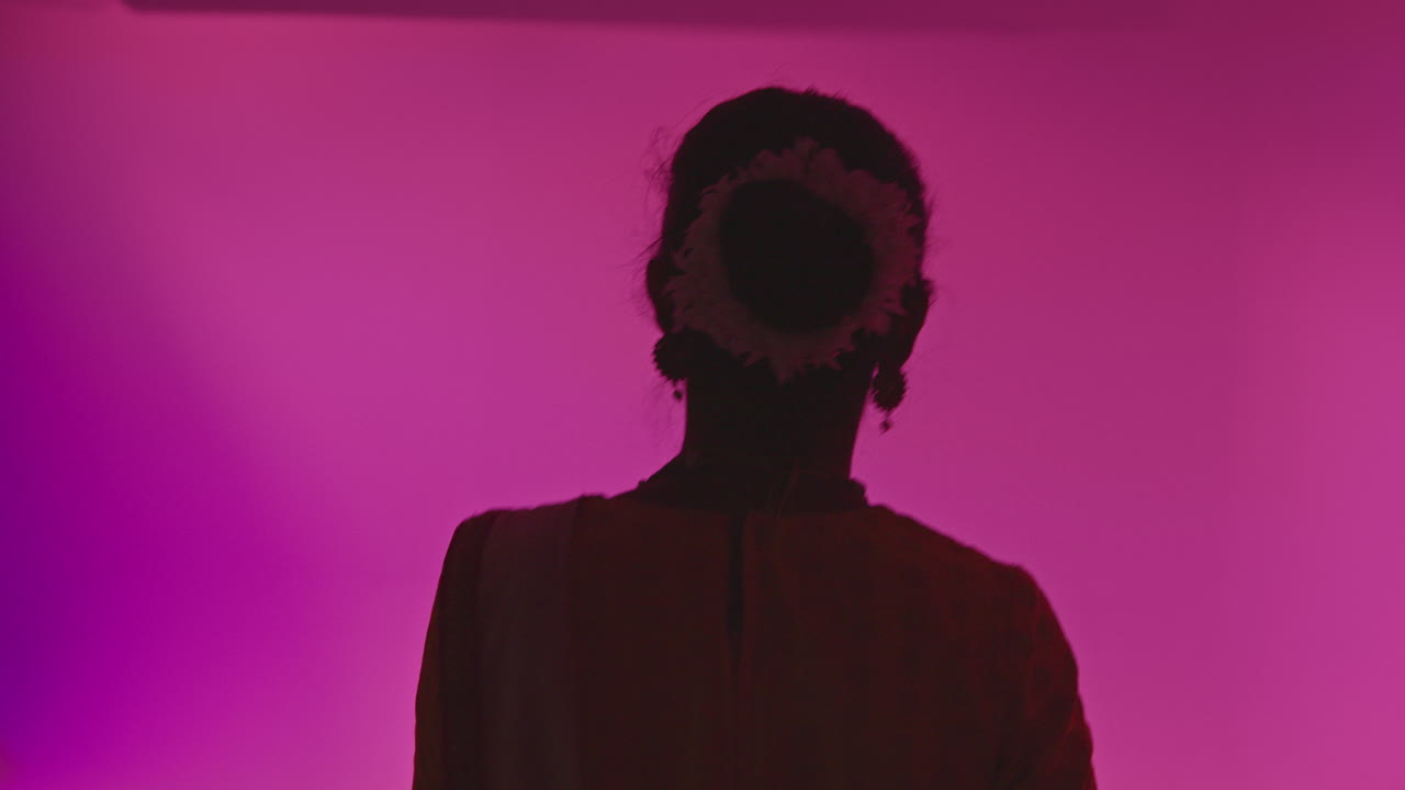 Female Kathak Dancer Wearing Traditional Indian Dress Walking Onto Set Of Film Or Video Studio And Dancing