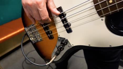 person playing bass guitar