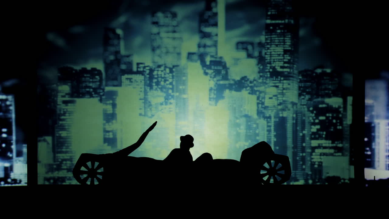 Silhouette of a Car and Cityscape
