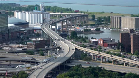 An-aerial-view-of-the-city-of-Buffalo,-New-York-and-its-infrastructure-of-bridges-and-buildings-beside-Lake-Erie