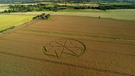 paranormal farmland crop circle geometry artwork stanton st bernard aerial view wiltshire pull back