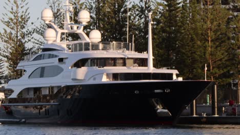 a luxury yacht docks at a marina