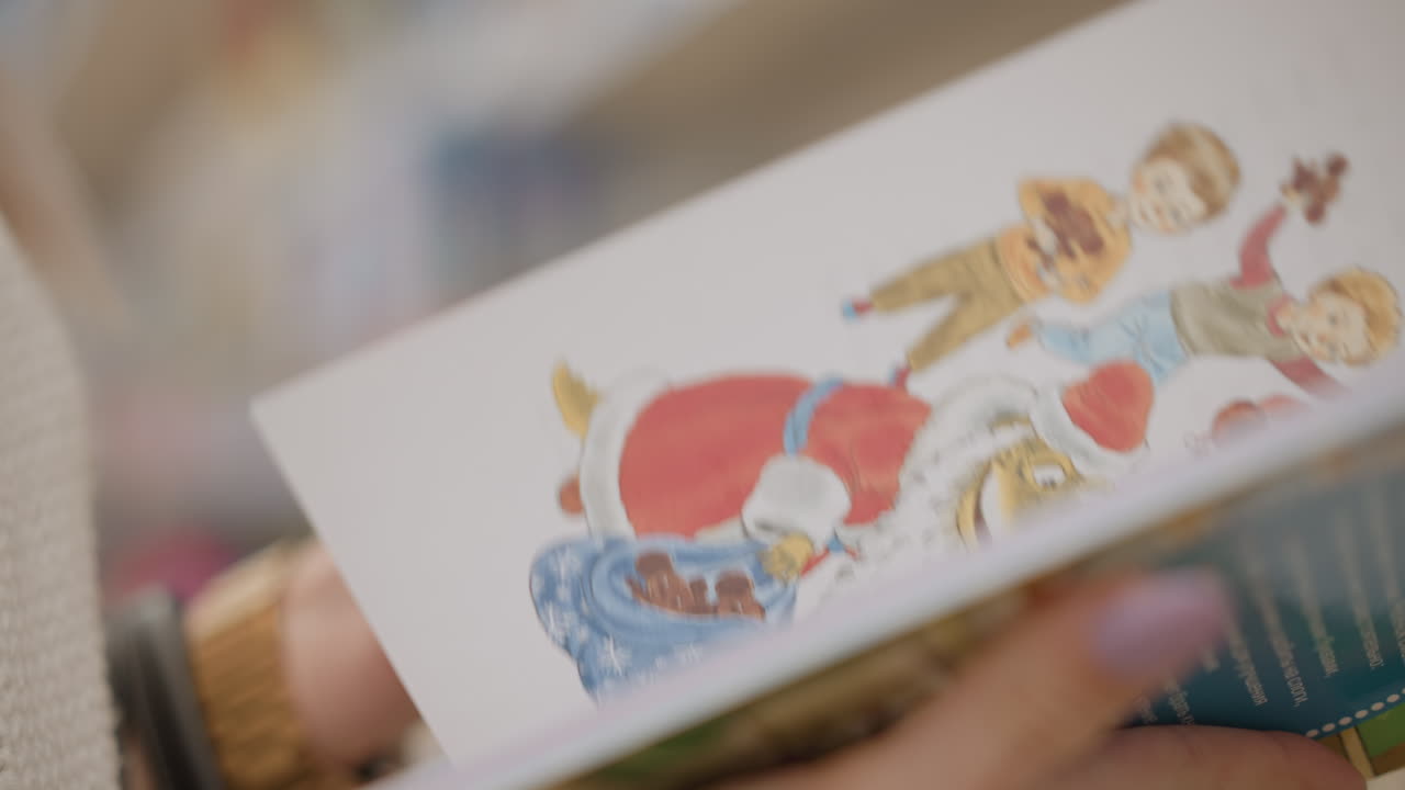 close up of expectant mother hand holding illustrated children textbook with colorful drawings and text pages in retail store aisle while browsing selection against blurred background