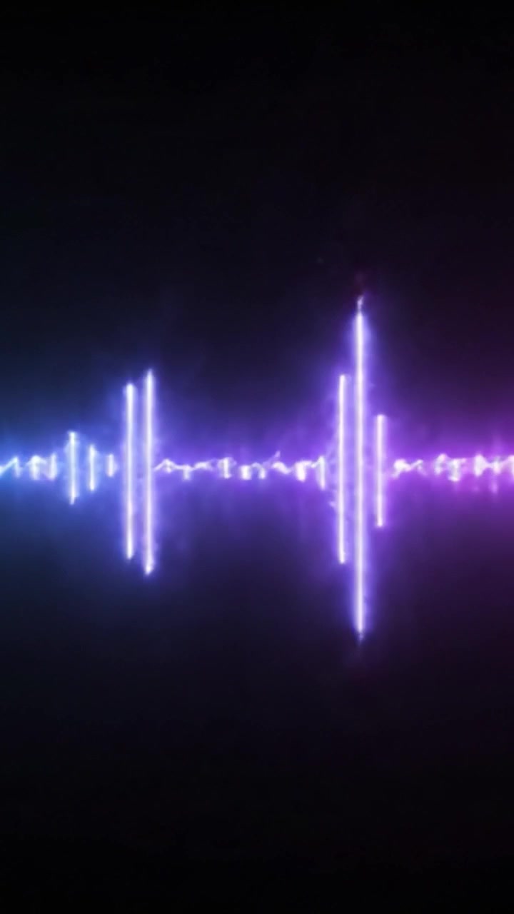 A Visual Symphony: Captivating Transition of Neon Sound Waves from Blue to Pink in a Stunning Display of Light and Energy