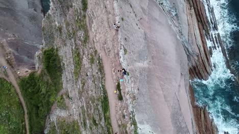 Couple-on-the-cliffs-of-Zumaia-seen-from-above