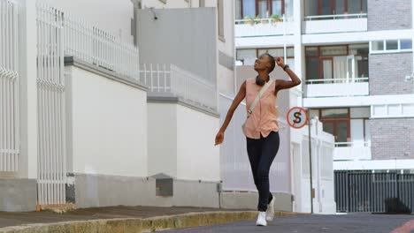 woman walking in city street 4k