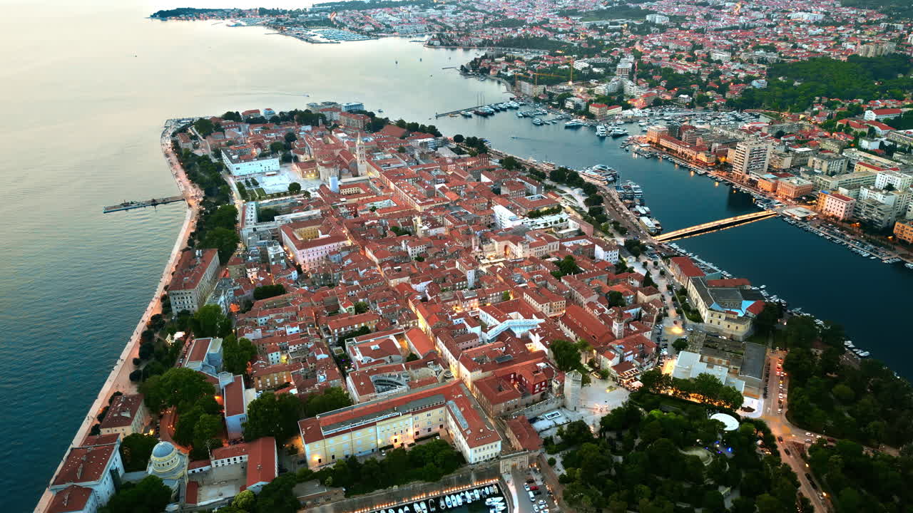 Aerial drone view of Zadar in evening, Croatia. Historical city centre with old buildings and water channels