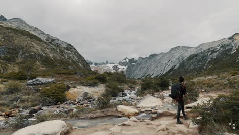 a man on hiking trails in laguna esmeralda near ushuaia, tierra de fuego in argentina