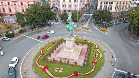 piazza corvetto with scenic flower beds and equestrian bronze statue, drone view