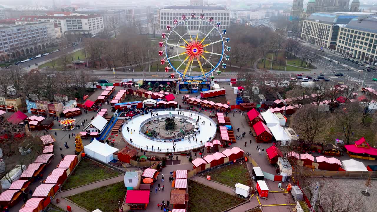 View remarkable architecture lining the canals of Amsterdam as people stroll along the waterfront. The cloudy sky adds a unique charm to this vibrant city scene
