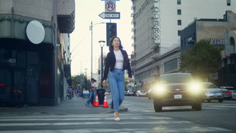 Asian-girl-going-crosswalk-modern-city.-Tourist-woman-crossing-town-road.