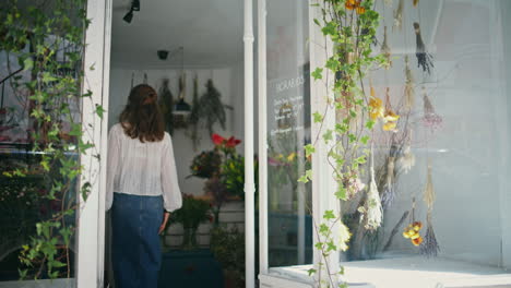 entrepreneur woman open florist shop. confident girl owner work at flower store.