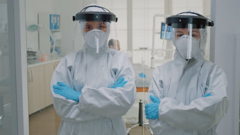 professional team of dentists in ppe suits standing