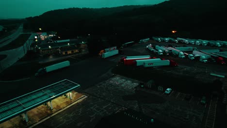 semi truck stop enters ta travel truck stop for resting overnight. british petroleum - bp gas station.