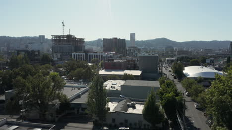 dolly foreward over trees and buildings in eastern portland susnet