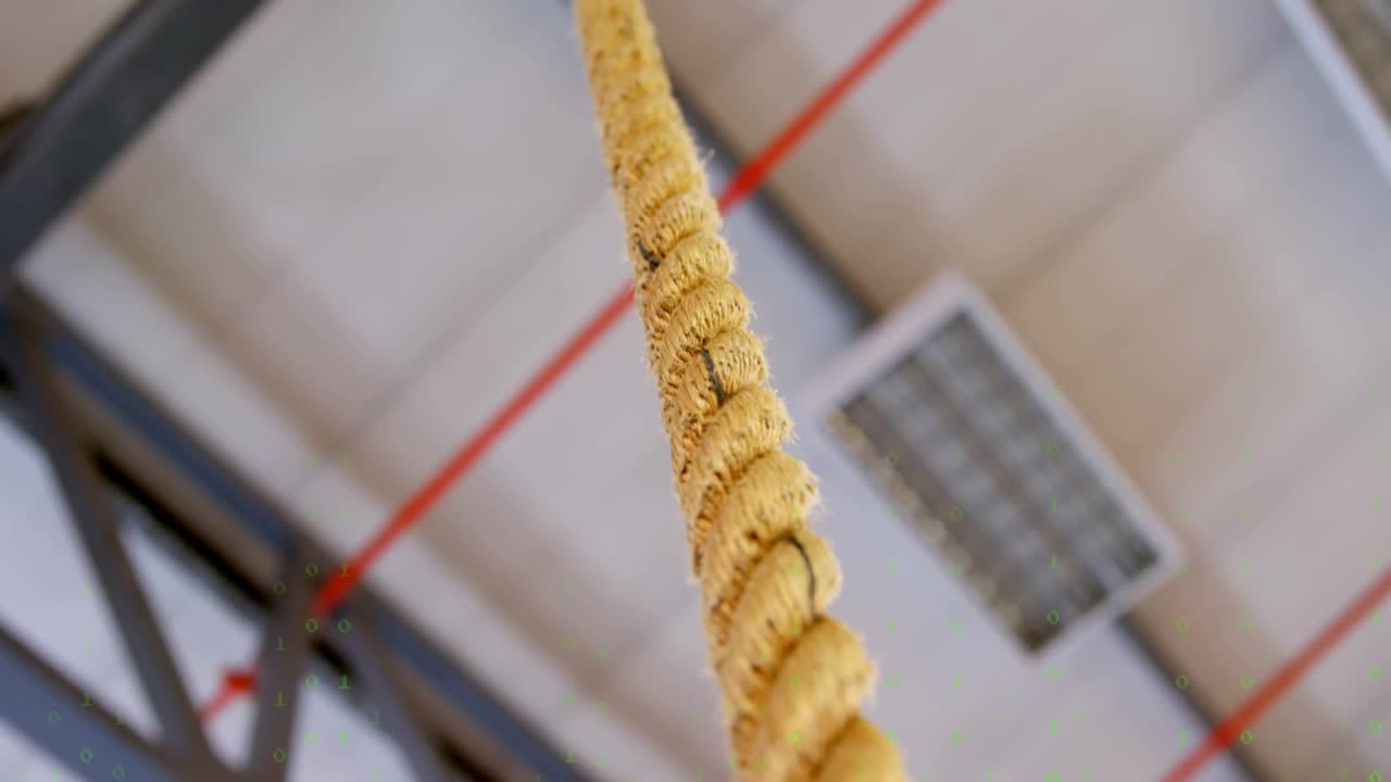 Code overlay initiating camera tilting down tracking swaying braided rope highlighting structure