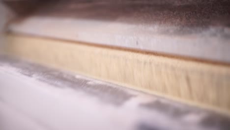 close-up of a roller mill grinding wheat in an industrial milling factory