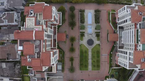 aerial view of apartment complex with courtyard and pool
