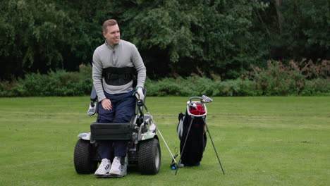 man playing golf with adaptive equipment