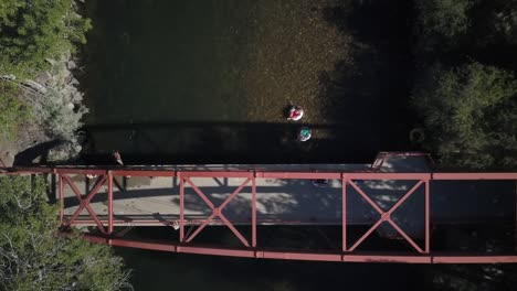 aerial view person jumping off bridge into boise river