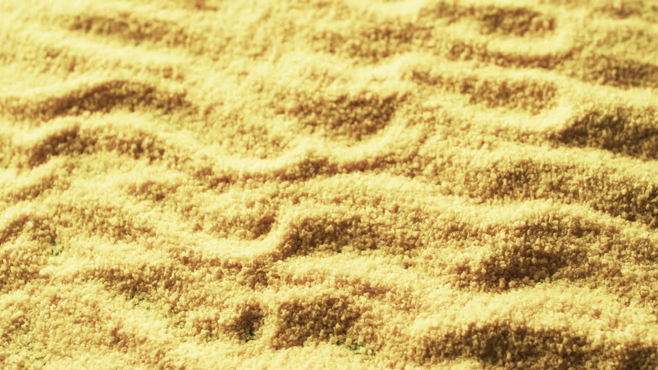 Close-up of a textured carpet with a wavy pattern