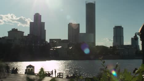 city skyline by the river at sunset
