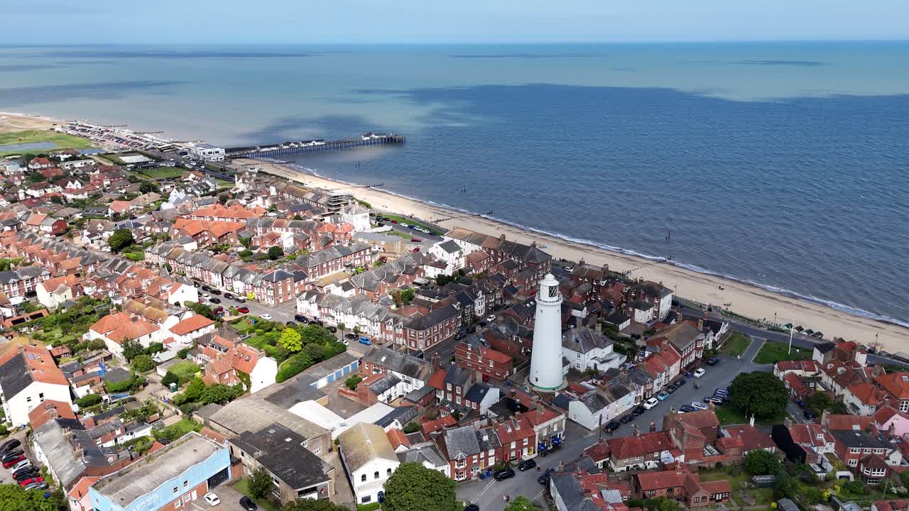 Aerial View of a Coastal Town with a Lighthouse