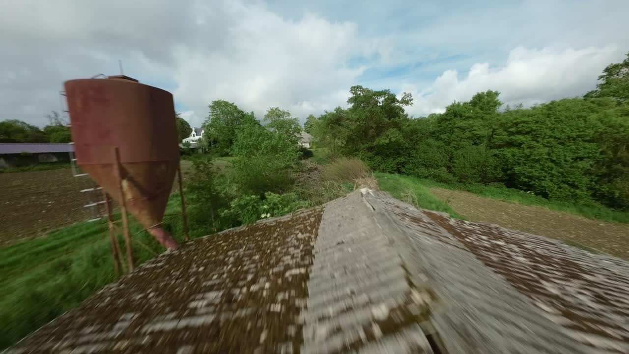 Drone Footage of an Abandoned and Overgrown Barn in the Countryside