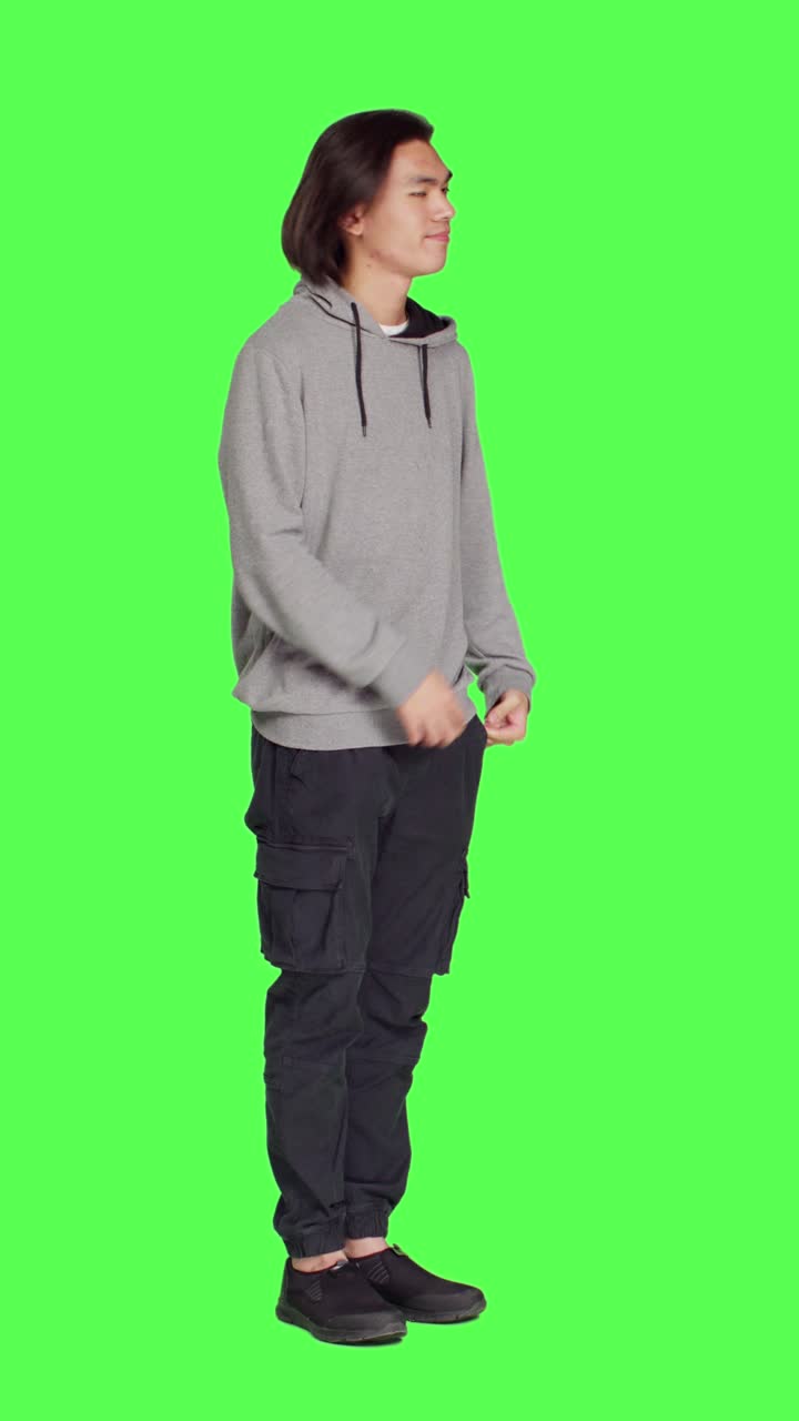 Side view of dissatisfied man in studio awaiting