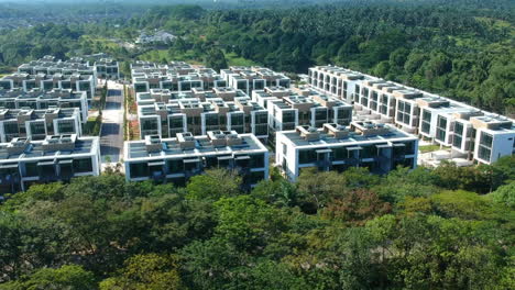 wide shots of mix houses in the middle of a forest with lake