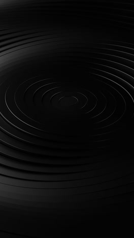 black background with circular design in the center. vertical looped animation