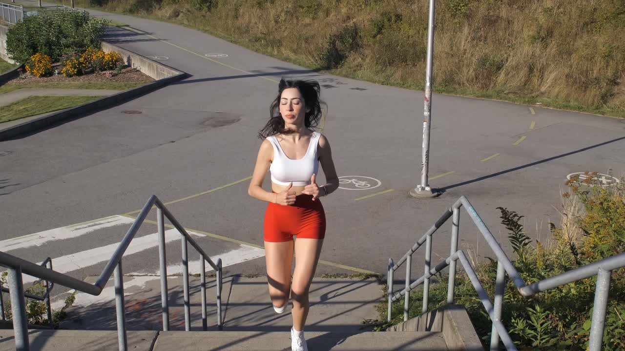 Sportive Girl Running Up Outdoors Flight of Stairs - Frontal Slomo