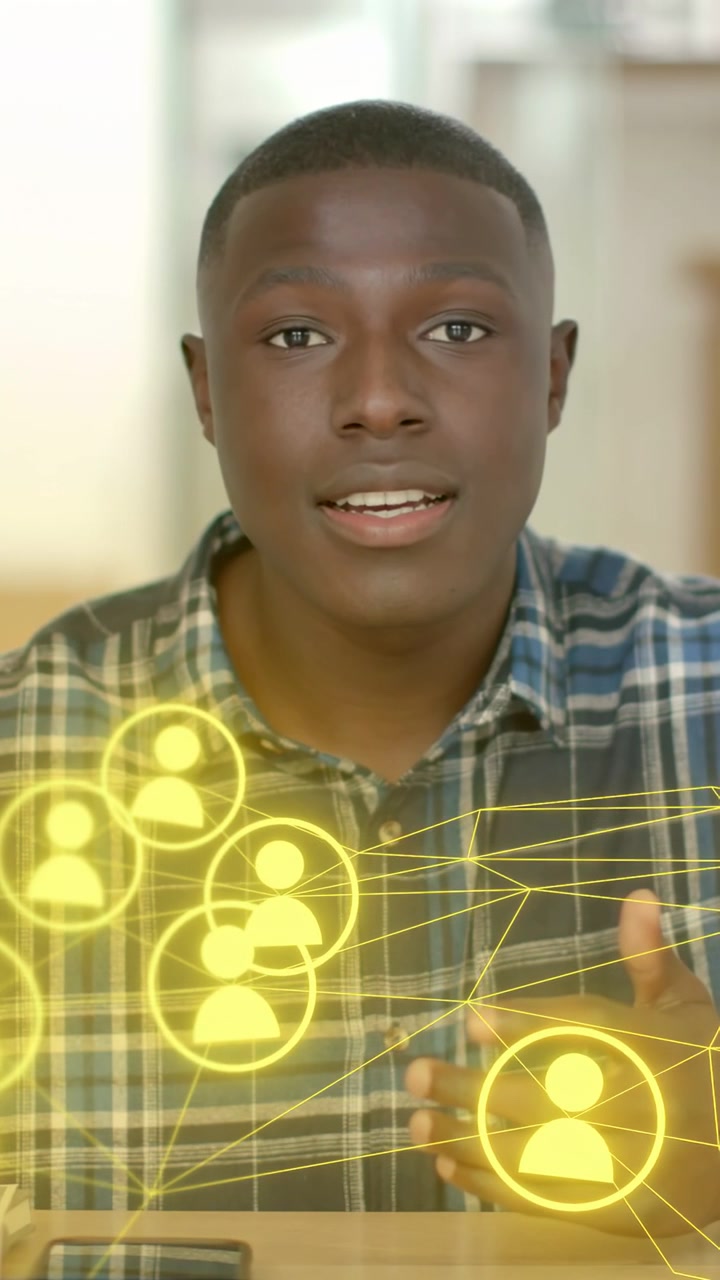 Vertical video: Man explaining networking, gesturing to phone and initiating yellow node overlay
