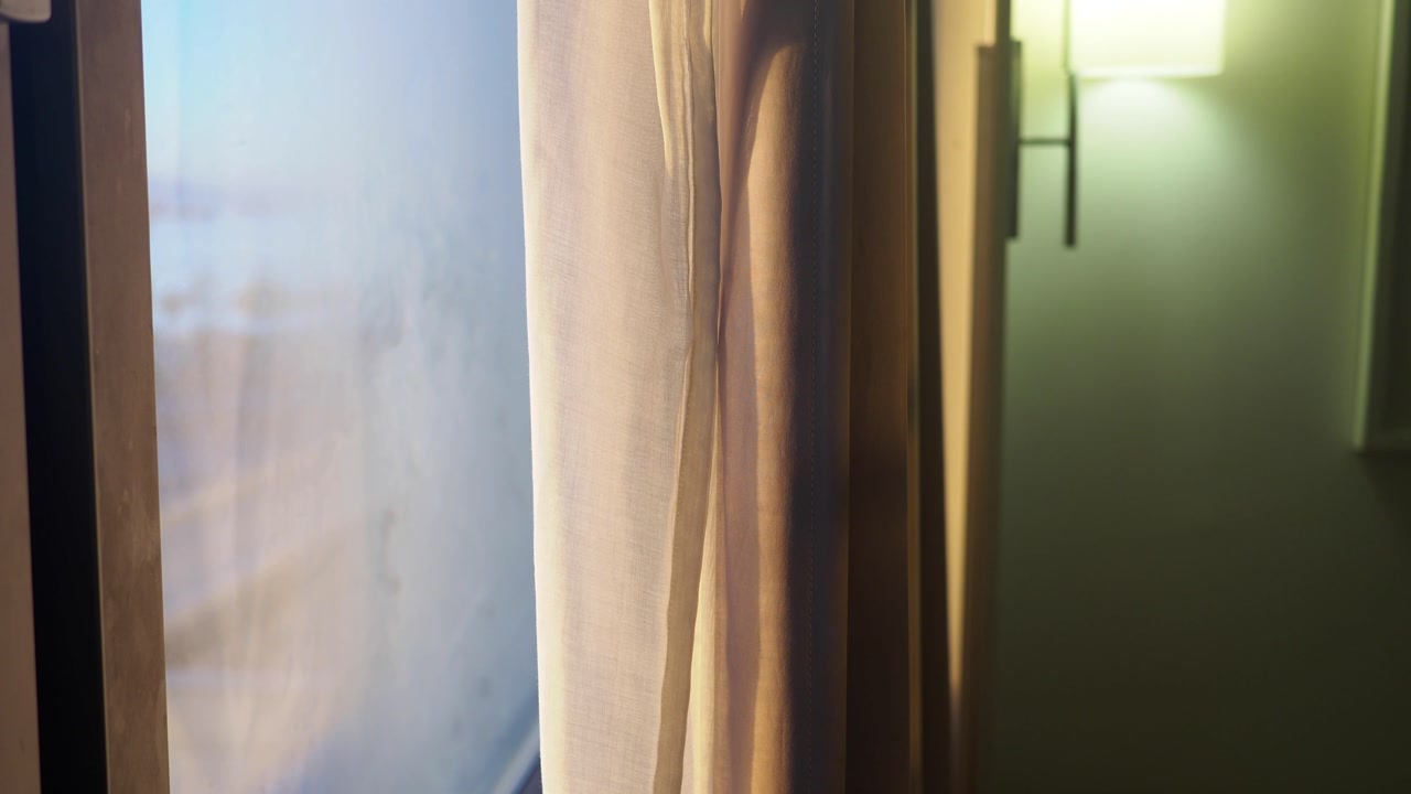 Sunlight Through Sheer Curtains Moving in a Gentle Breeze