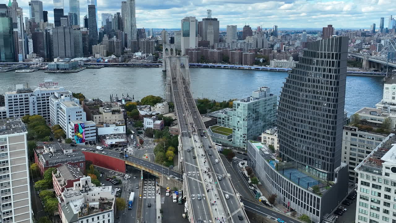 Brooklyn Bridge With The Olympia Dumbo Luxury Residential Condominium In The Neighborhood Of Brooklyn In New York City, United States. Aerial Drone Shot