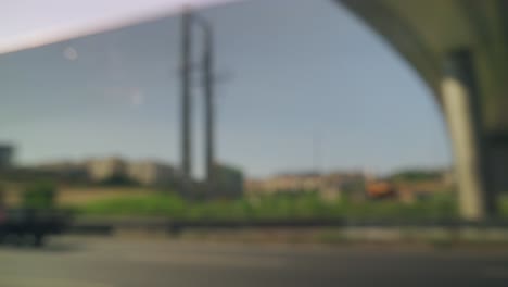 out-of-focus urban road scenes with vehicles and city infrastructure