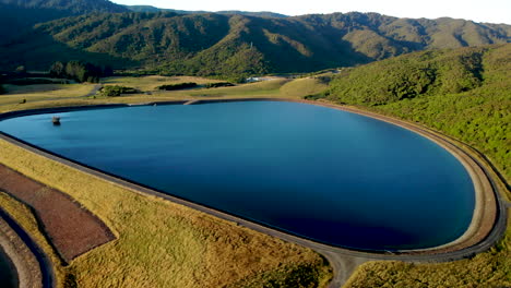 aerial view of water reservoir, golden hour