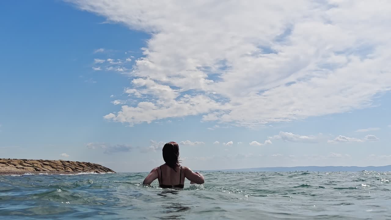 beautiful woman swimming in the sea