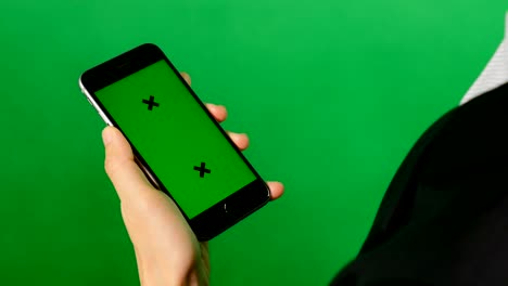 a blank green screen mobile phone on green background.