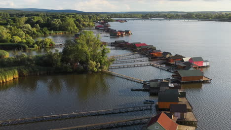 stilt village in hungary over the bokodi-hutoto lake, aerial drone shot