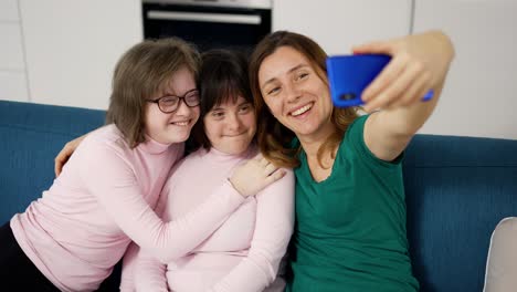 Woman-with-down-syndrome-with-her-mom-taking-photos-with-the-phone