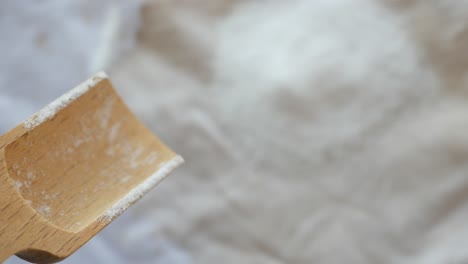 wooden spoon with flour