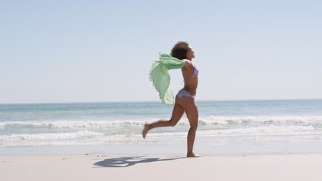 young woman running at the beach 4k